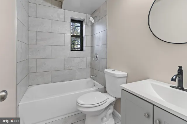 a bathroom with a sink toilet and bathtub