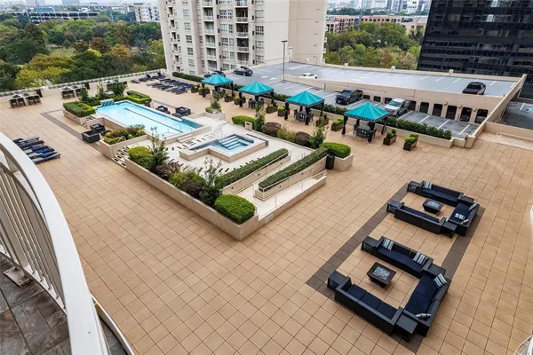 a view of a balcony with chairs and wooden floor