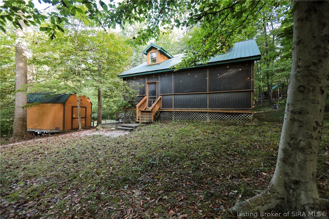 3320 Bluff Road Birdseye, IN 47513 - Photo 1 of 61 Cozy cabin surrounded by trees.