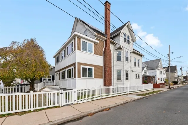 a view of a street with a building in the background