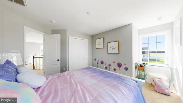 a bedroom with a bed and a cabinets