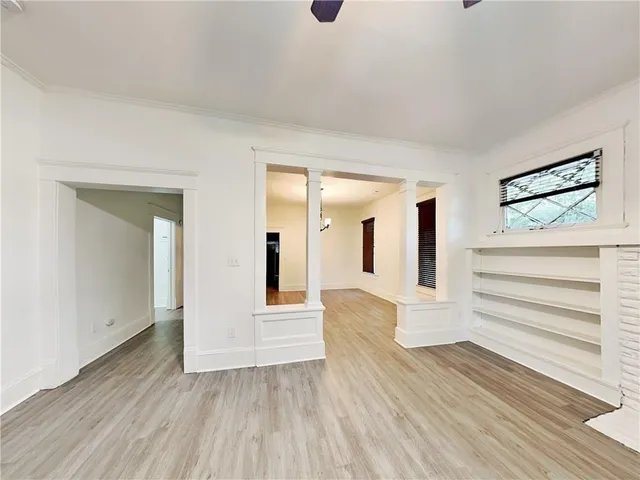 a view of front door with wooden floor