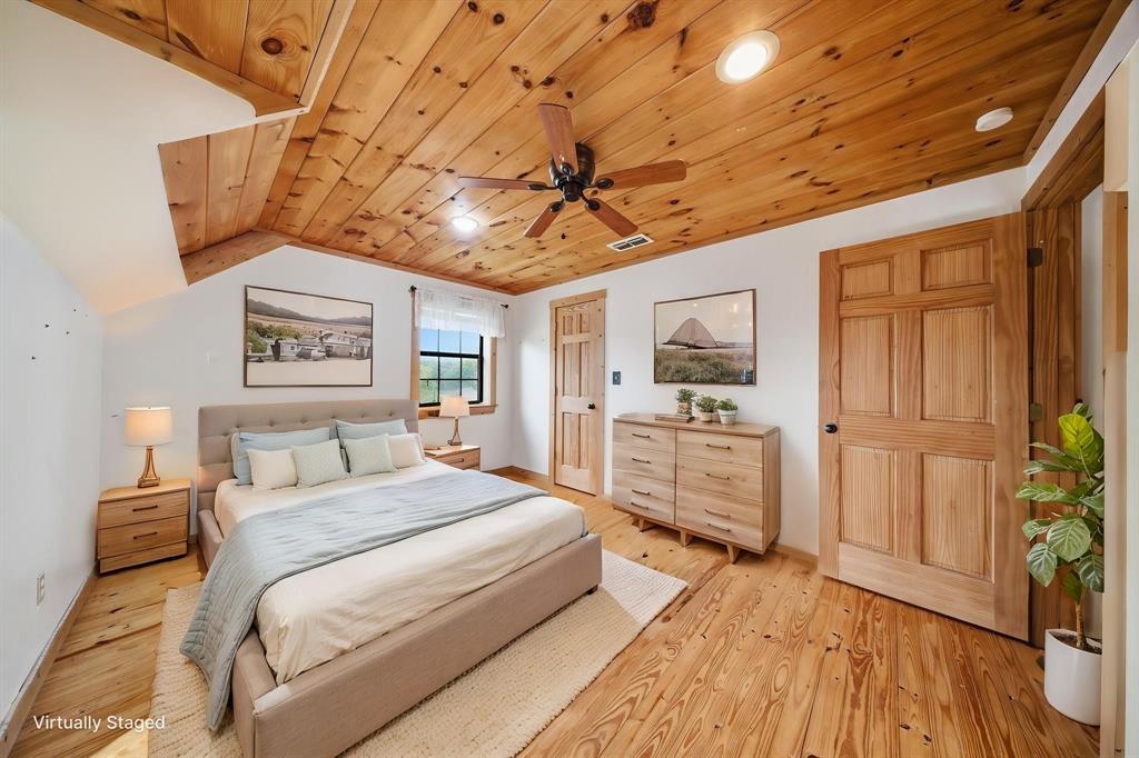 465 Emberson Ranch Road Pilot Point, TX 76258 - Photo 21 of 40 a bedroom with a bed and a view of bathroom