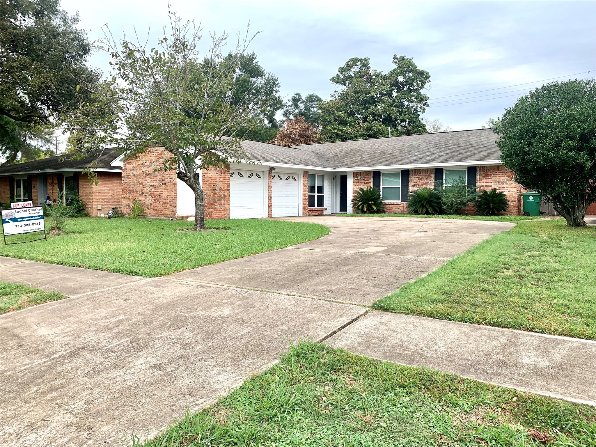 7414 Carew Street Houston, TX 77074 - Photo 2 of 15 a front view of a house with a yard and trees