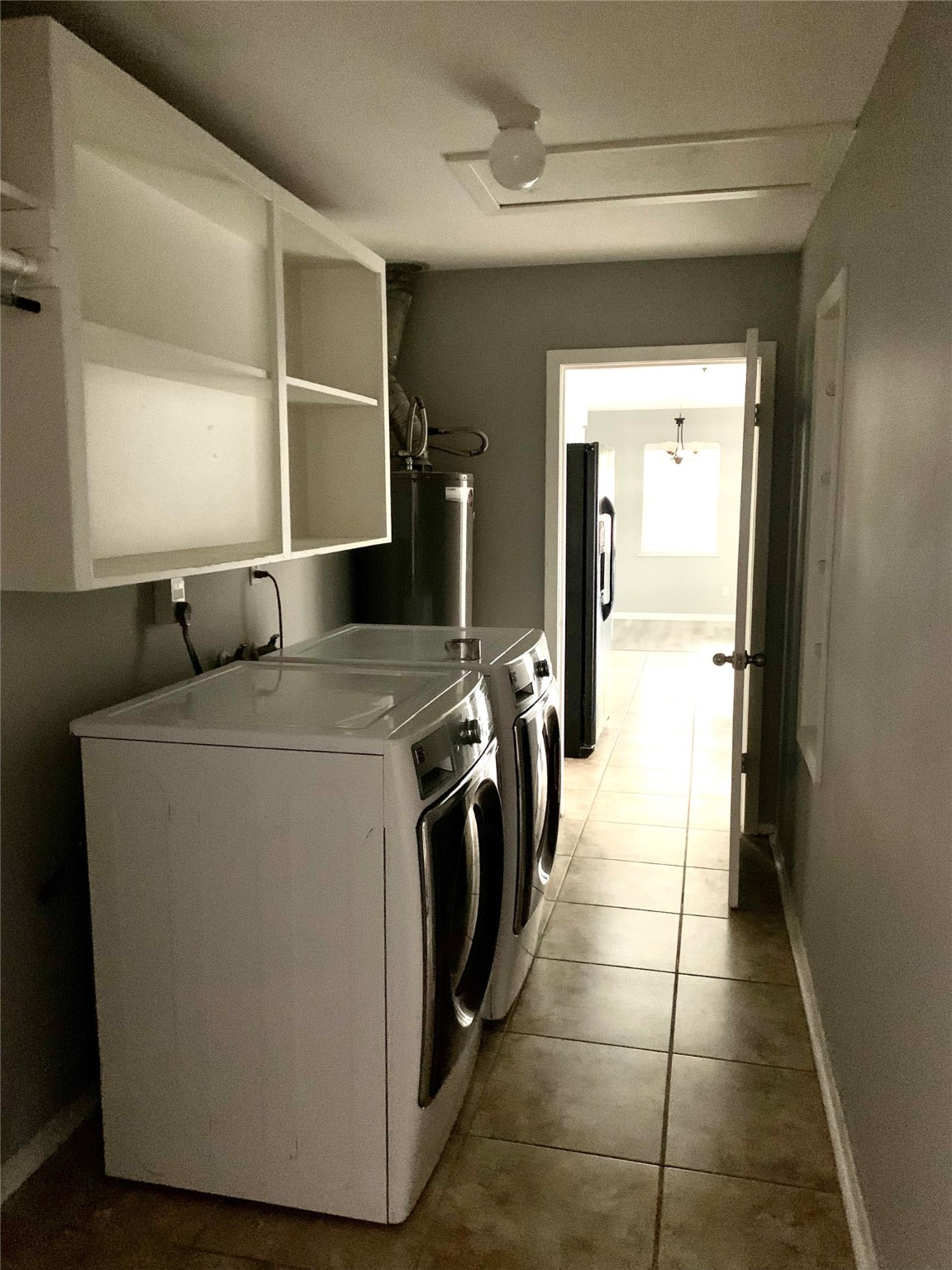 7414 Carew Street Houston, TX 77074 - Photo 9 of 15 a utility room with washer and dryer
