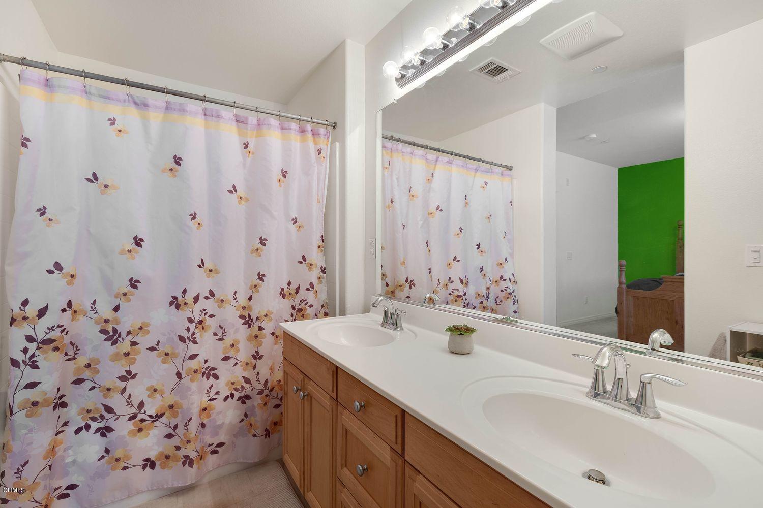 608 Flathead River Street Oxnard, CA 93036 - Photo 17 of 21 a bathroom with a sink and a mirror