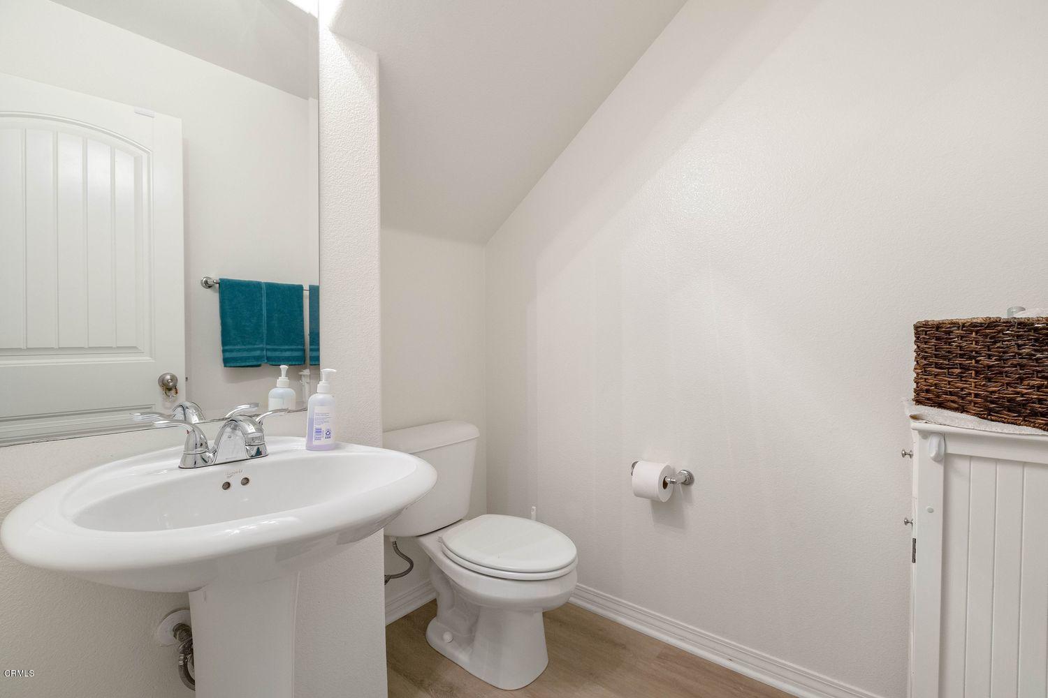 608 Flathead River Street Oxnard, CA 93036 - Photo 18 of 21 a bathroom with a sink a toilet and mirror