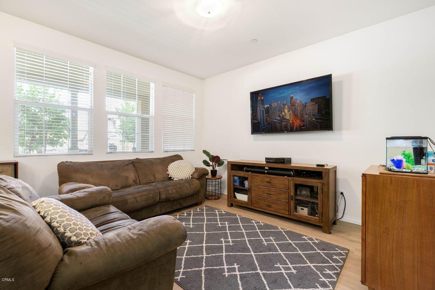 608 Flathead River Street Oxnard, CA 93036 - Photo 3 of 21 a living room with furniture and a flat screen tv