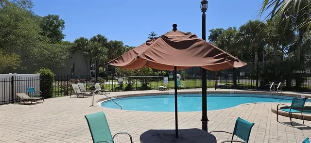 a view of a backyard with sitting area