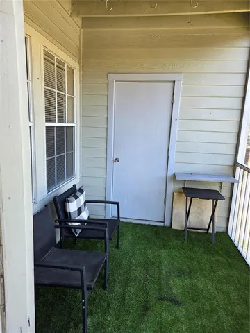 a house view with a sitting space and garden