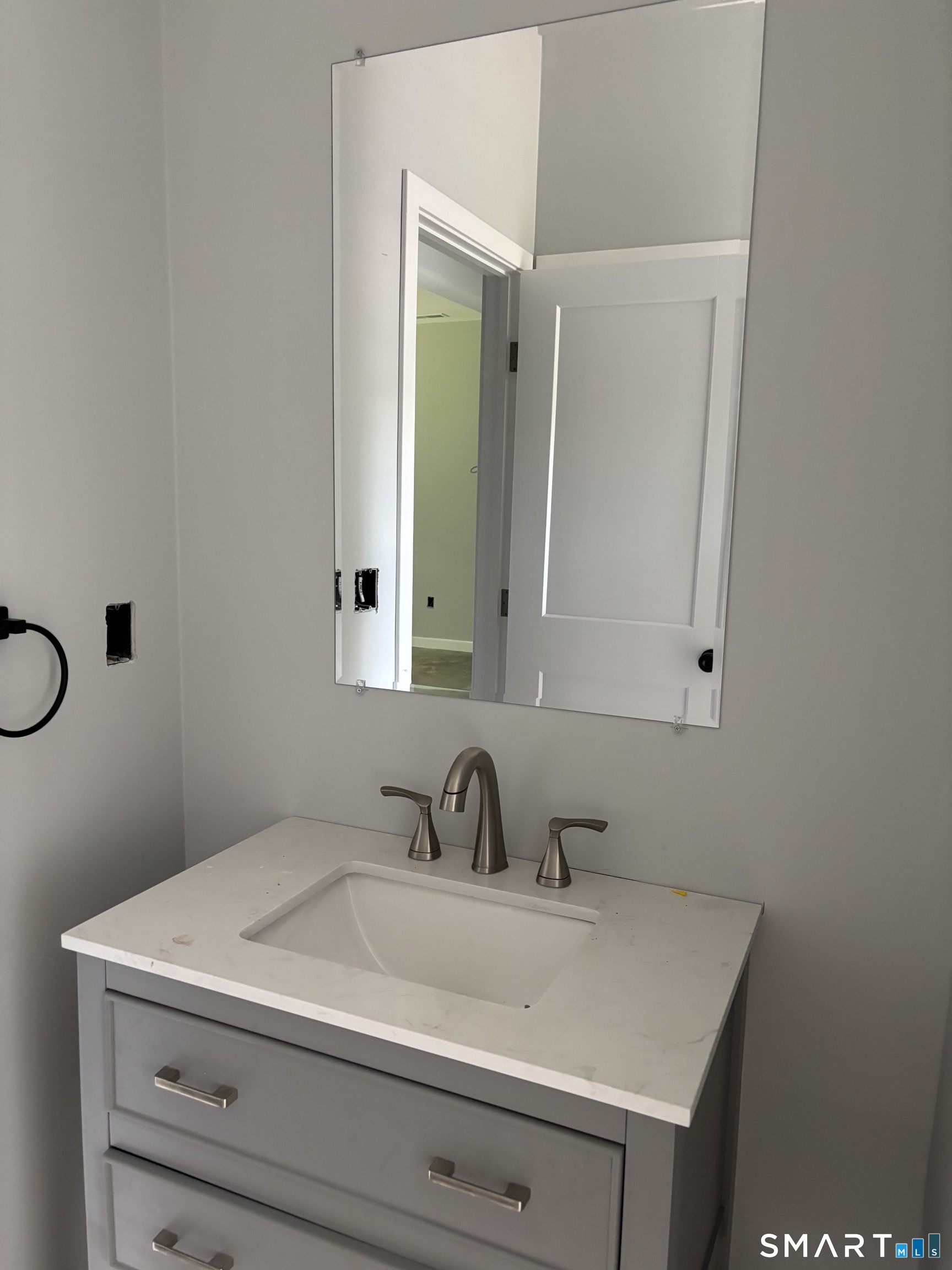 9 Putnam Park Road Bethel, CT 06801 - Photo 13 of 16 a bathroom with a sink and a mirror