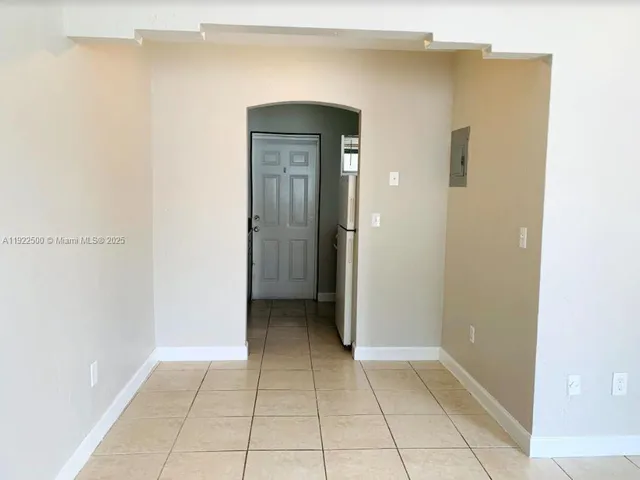 a view of a hallway to rooms