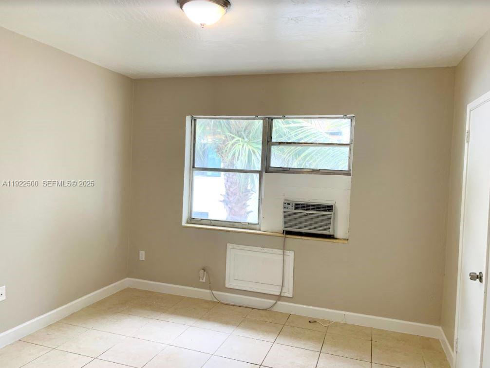 1255 Southwest 6th Street, Unit 4 Miami, FL 33135 - Photo 7 of 9 an empty room with windows