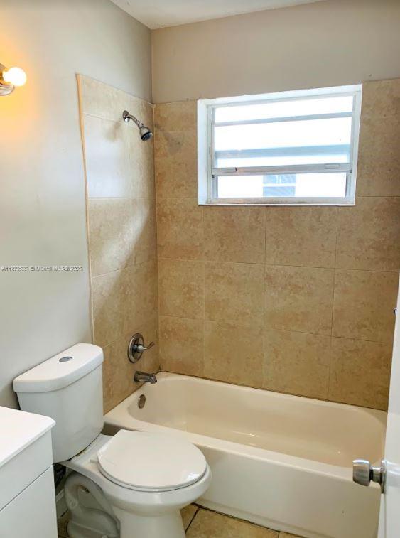 1255 Southwest 6th Street, Unit 4 Miami, FL 33135 - Photo 8 of 9 a bathroom with a toilet and a bathtub