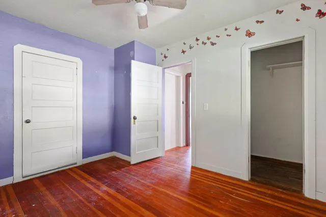 a bathroom with a tub a sink and mirror
