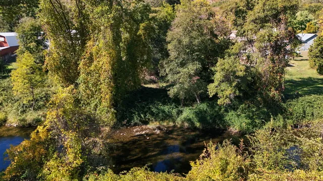 a view of a livingroom with furniture and an empty room