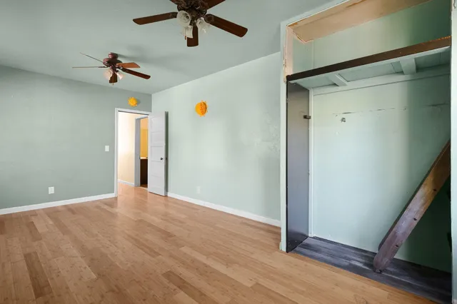 a view of a glass door with a chair