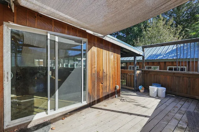 a view of backyard with cabin
