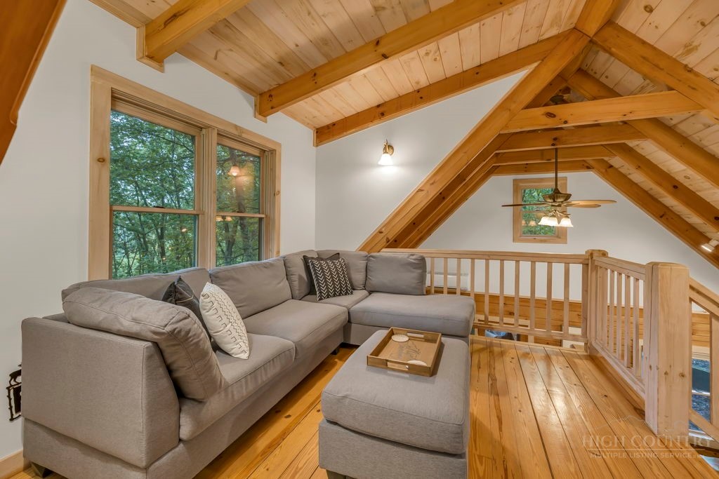 192 Dewitt Barnett Road Vilas, NC 28692 - Photo 20 of 32 a living room with furniture and a large window