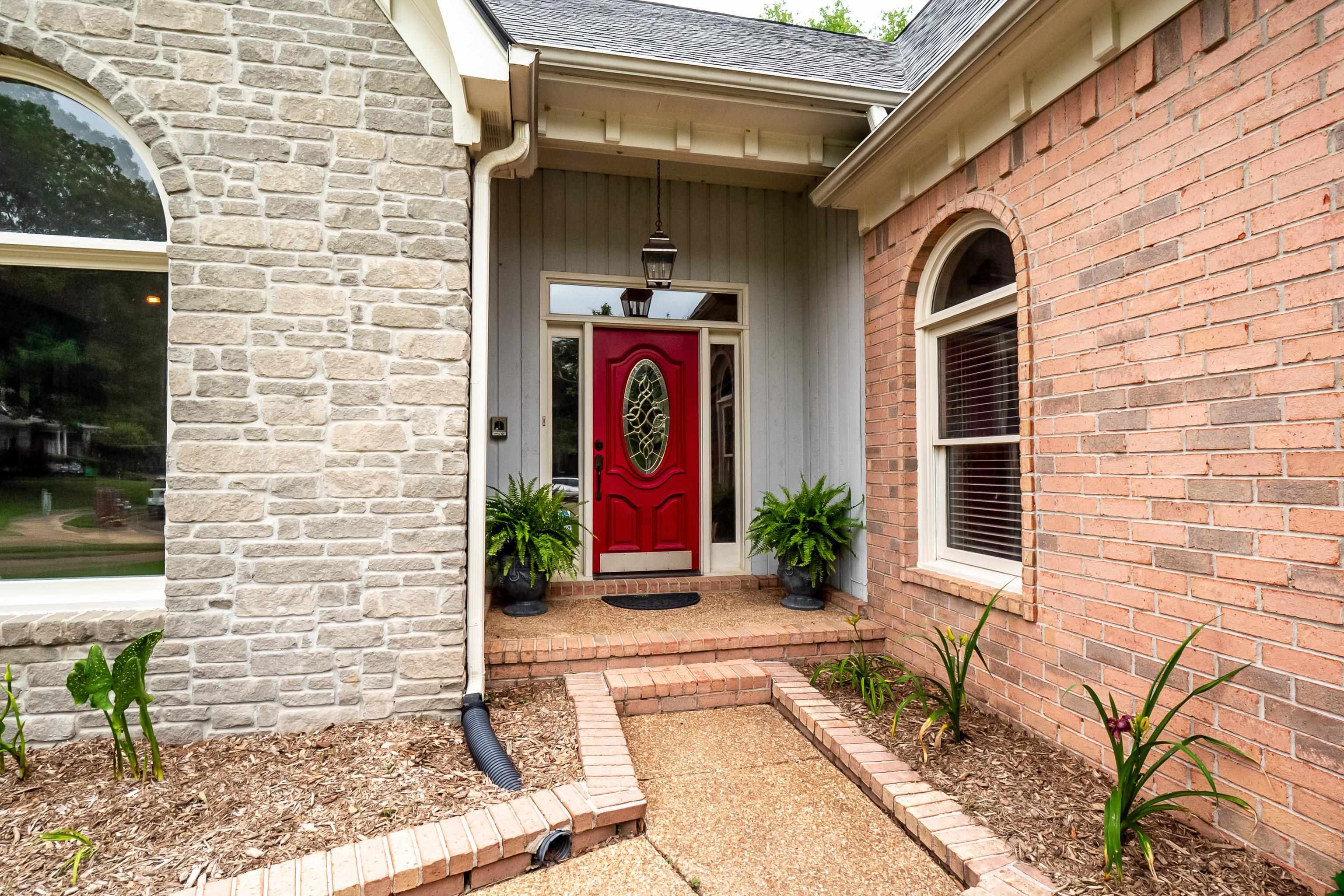 1050 Crosswinds Cove Collierville, TN 38017 - Photo 13 of 40 a front view of a house with entryway
