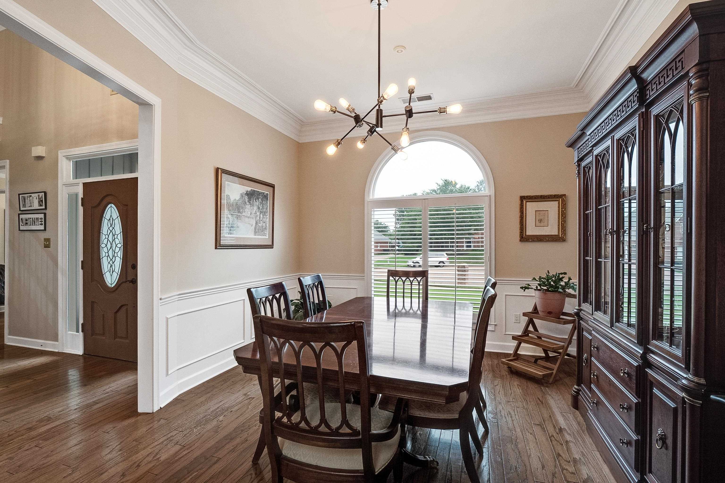 1050 Crosswinds Cove Collierville, TN 38017 - Photo 18 of 40 a view of a dining room with furniture window and wooden floor
