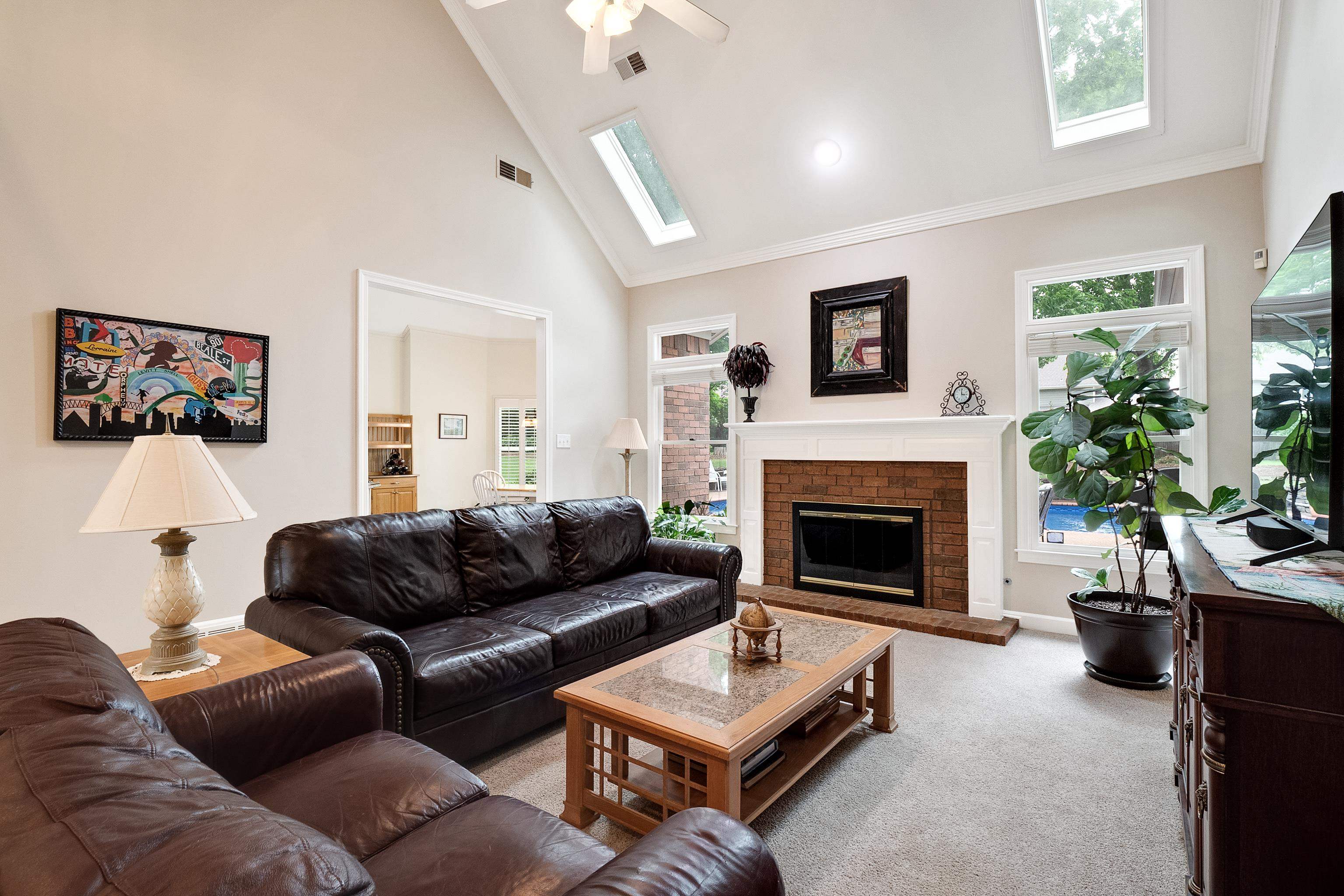 1050 Crosswinds Cove Collierville, TN 38017 - Photo 24 of 40 a living room with furniture and a fireplace