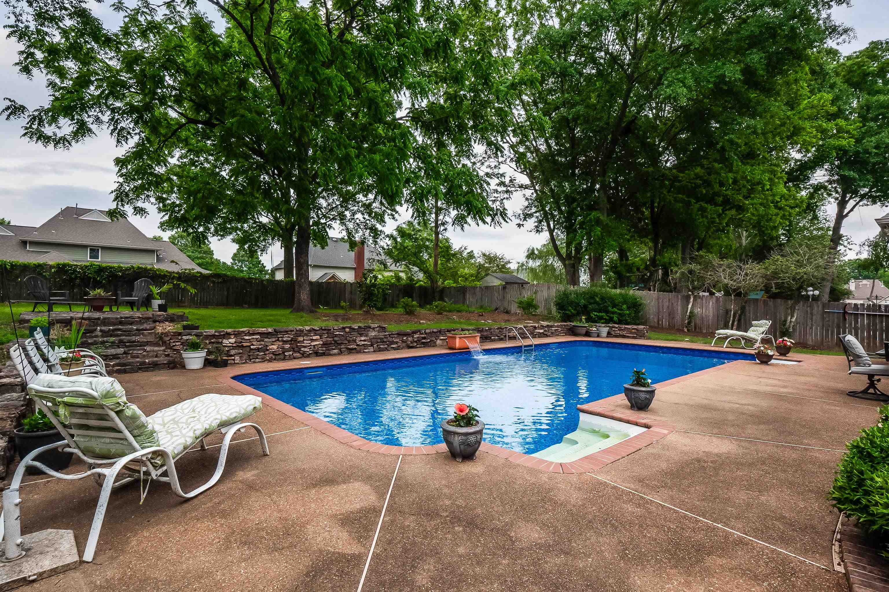 1050 Crosswinds Cove Collierville, TN 38017 - Photo 6 of 40 a view of a swimming pool with lounge chairs