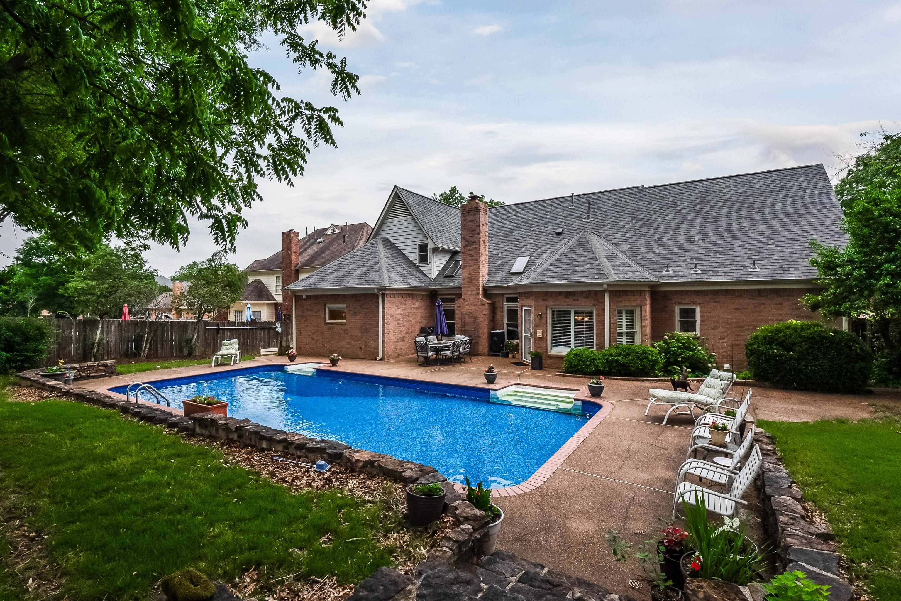 1050 Crosswinds Cove Collierville, TN 38017 - Photo 7 of 40 a view of house with yard and outdoor seating