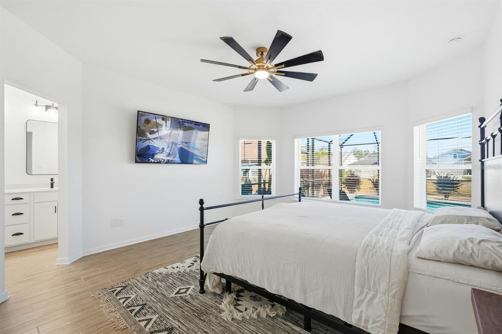 140 Nighthawk Lane Palm Coast, FL 32164 - Photo 13 of 43 a bedroom with a large bed and a window