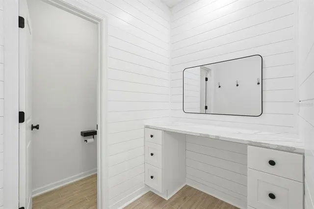 a bathroom with a sink and mirror