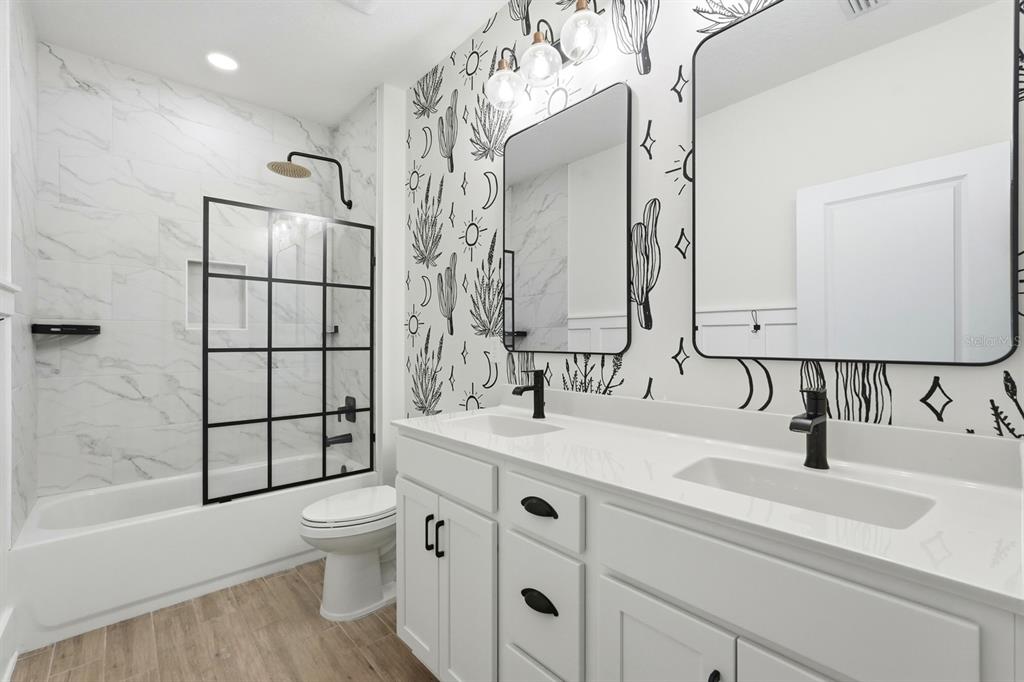 140 Nighthawk Lane Palm Coast, FL 32164 - Photo 19 of 43 a bathroom with a sink toilet tub and shower