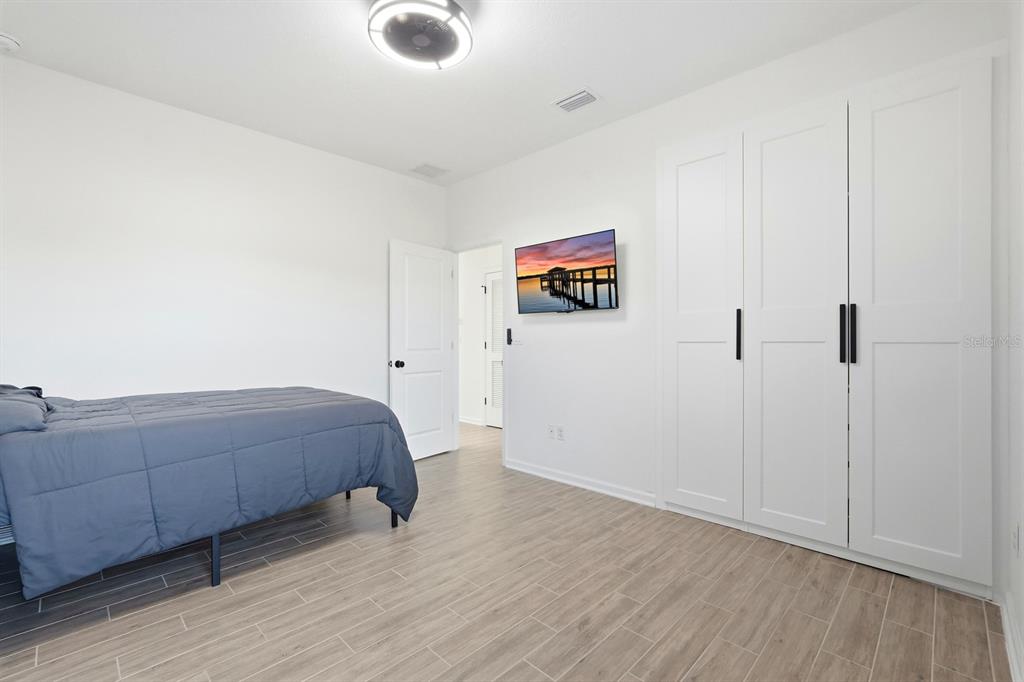 140 Nighthawk Lane Palm Coast, FL 32164 - Photo 20 of 43 a living room with furniture and a flat screen tv