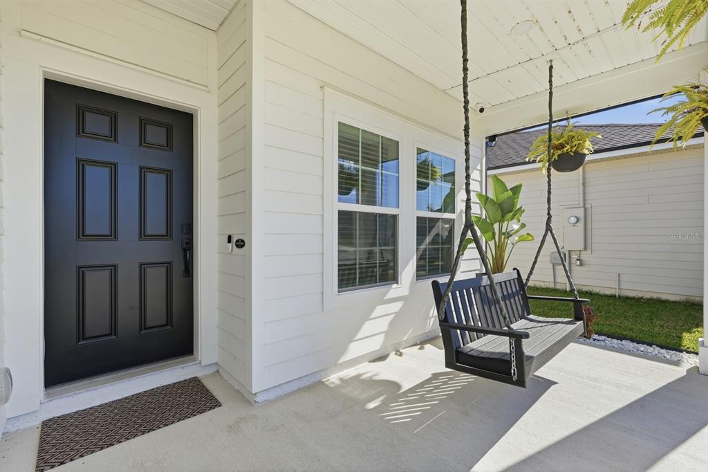 140 Nighthawk Lane Palm Coast, FL 32164 - Photo 2 of 43 a view of porch with seating space