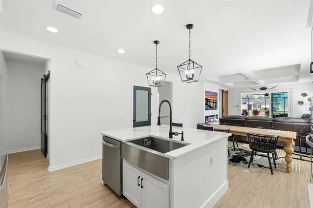 a kitchen that has a lot of cabinets in it