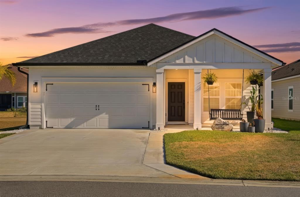 140 Nighthawk Lane Palm Coast, FL 32164 - Photo 32 of 43 a front view of a house with a big yard