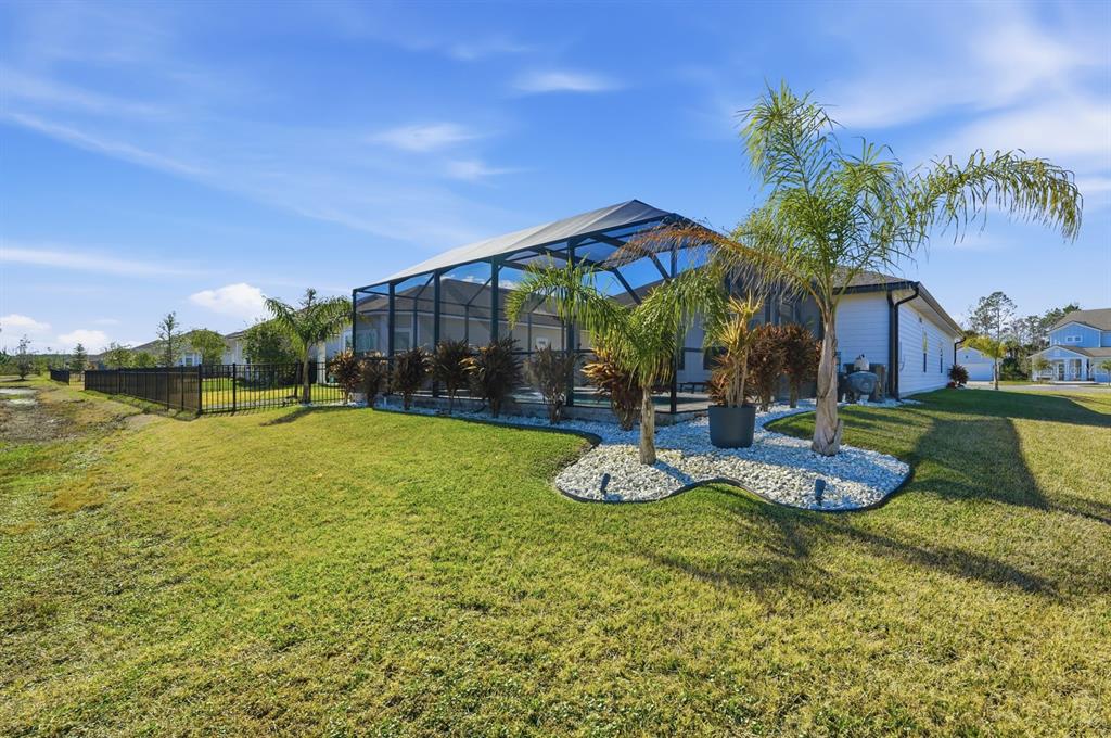 140 Nighthawk Lane Palm Coast, FL 32164 - Photo 33 of 43 a view of a house with garden and sitting area