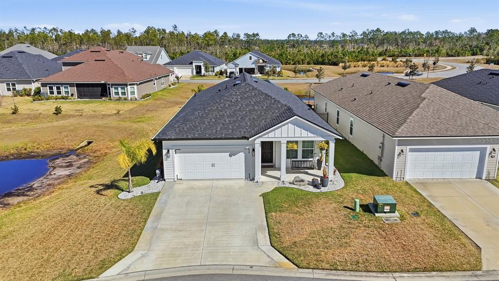 140 Nighthawk Lane Palm Coast, FL 32164 - Photo 38 of 43 an aerial view of a house with garden space and ocean view