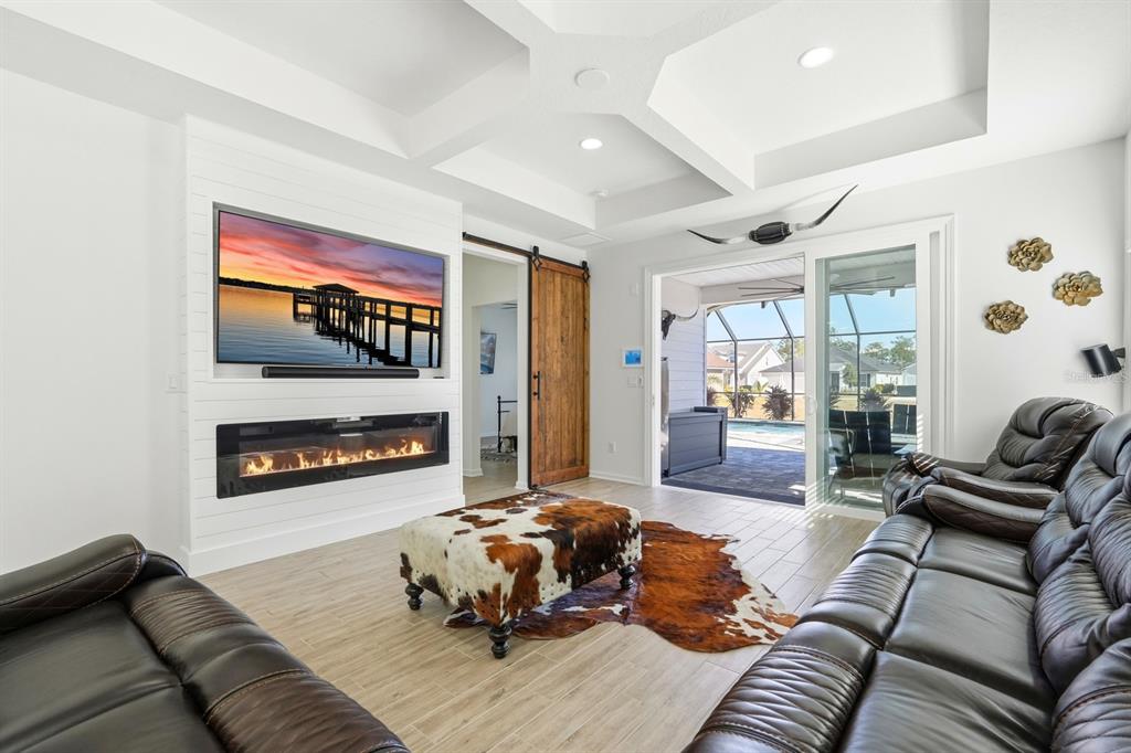 140 Nighthawk Lane Palm Coast, FL 32164 - Photo 4 of 43 a living room with furniture and a flat screen tv