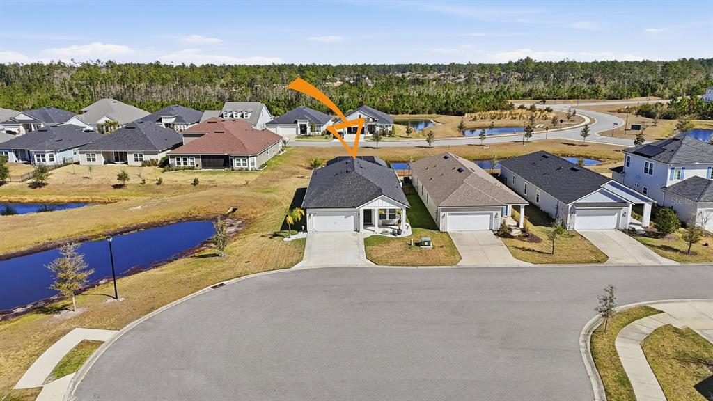 140 Nighthawk Lane Palm Coast, FL 32164 - Photo 41 of 43 an aerial view of a house with a swimming pool yard and outdoor seating