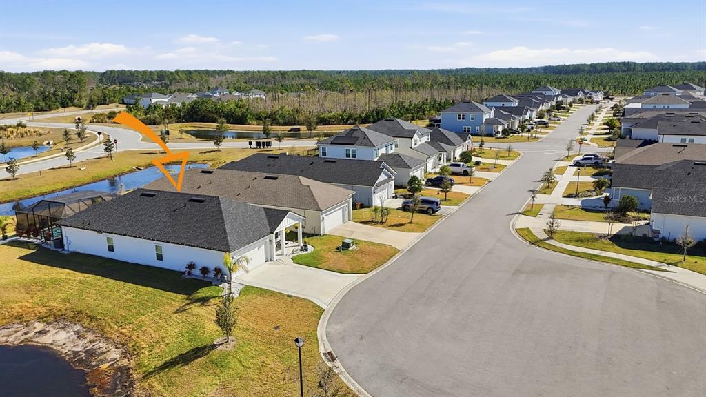 140 Nighthawk Lane Palm Coast, FL 32164 - Photo 42 of 43 an aerial view of a house with a swimming pool