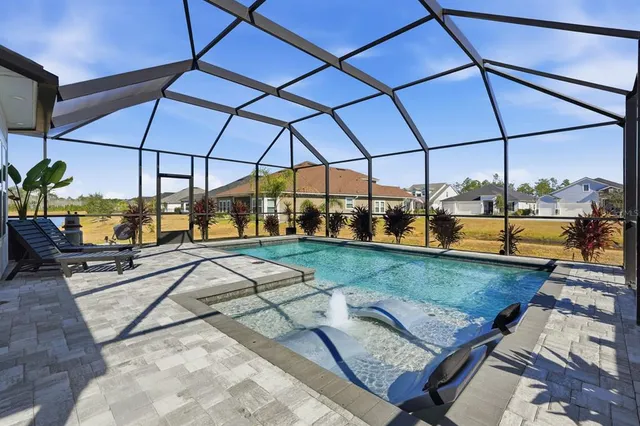 a view of a swimming pool with a patio