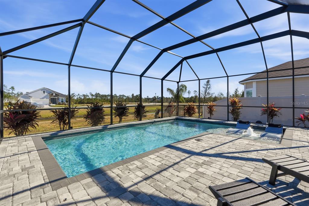 140 Nighthawk Lane Palm Coast, FL 32164 - Photo 8 of 43 a view of a swimming pool with a patio