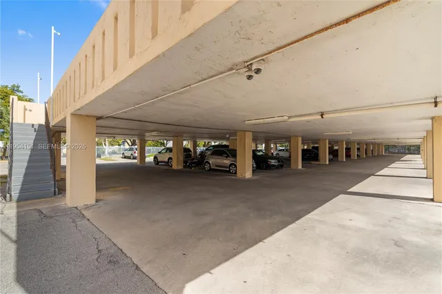 a view of a street with car parked