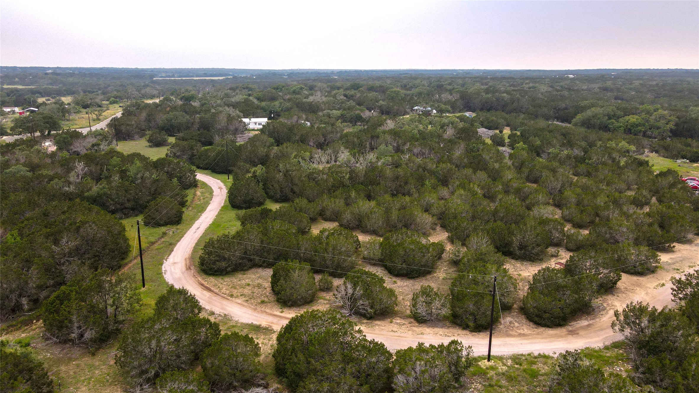 180 Robison Road Bertram, TX 78605 - Photo 11 of 12 Aerial view at dusk