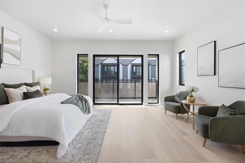 4615 Rusk Avenue Dallas, TX 75204 - Photo 26 of 40 a large bedroom with a large bed and a large window