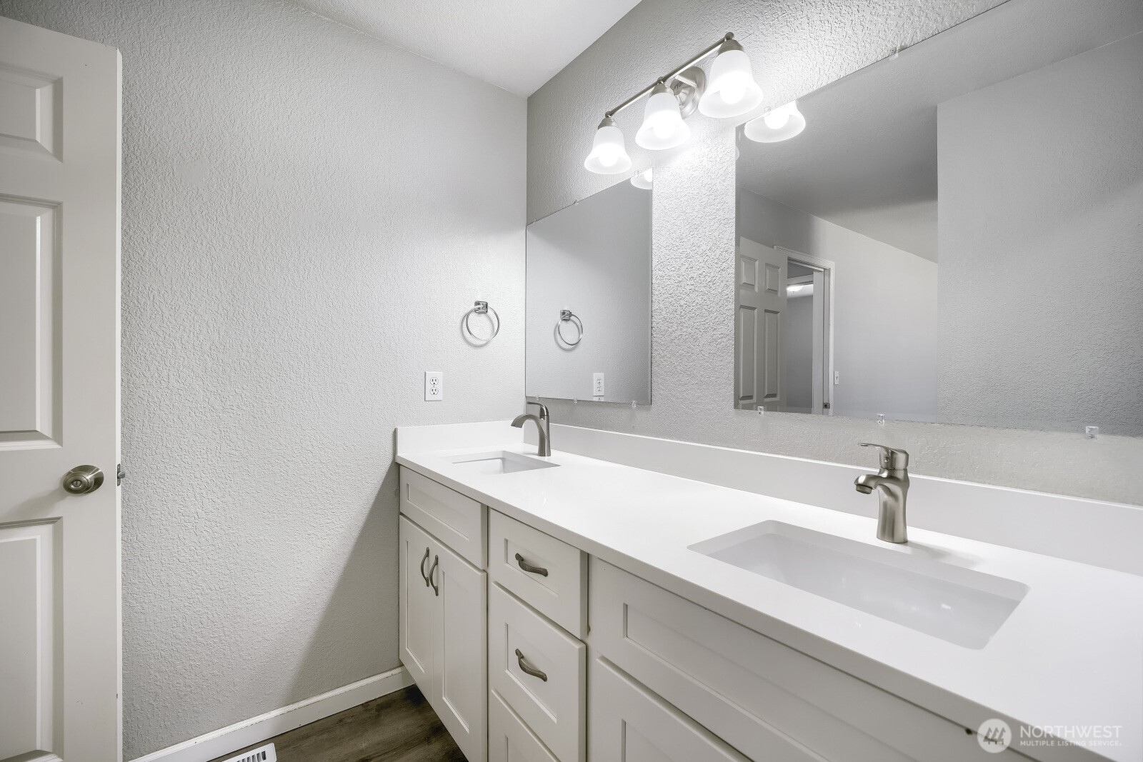 1607 Springfield Court Northeast Olympia, WA 98506 - Photo 13 of 21 a bathroom with a double vanity sink and a mirror