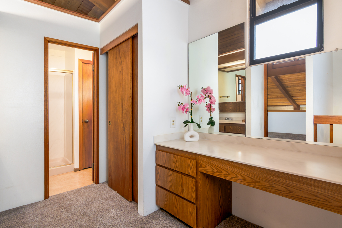 68-3840 Lua Kula Street, Unit D201 Waikoloa, HI 96738 - Photo 21 of 30 a bathroom with a granite countertop sink and a mirror