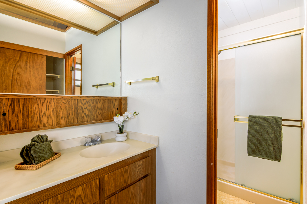 68-3840 Lua Kula Street, Unit D201 Waikoloa, HI 96738 - Photo 22 of 30 a bathroom with a sink and mirror