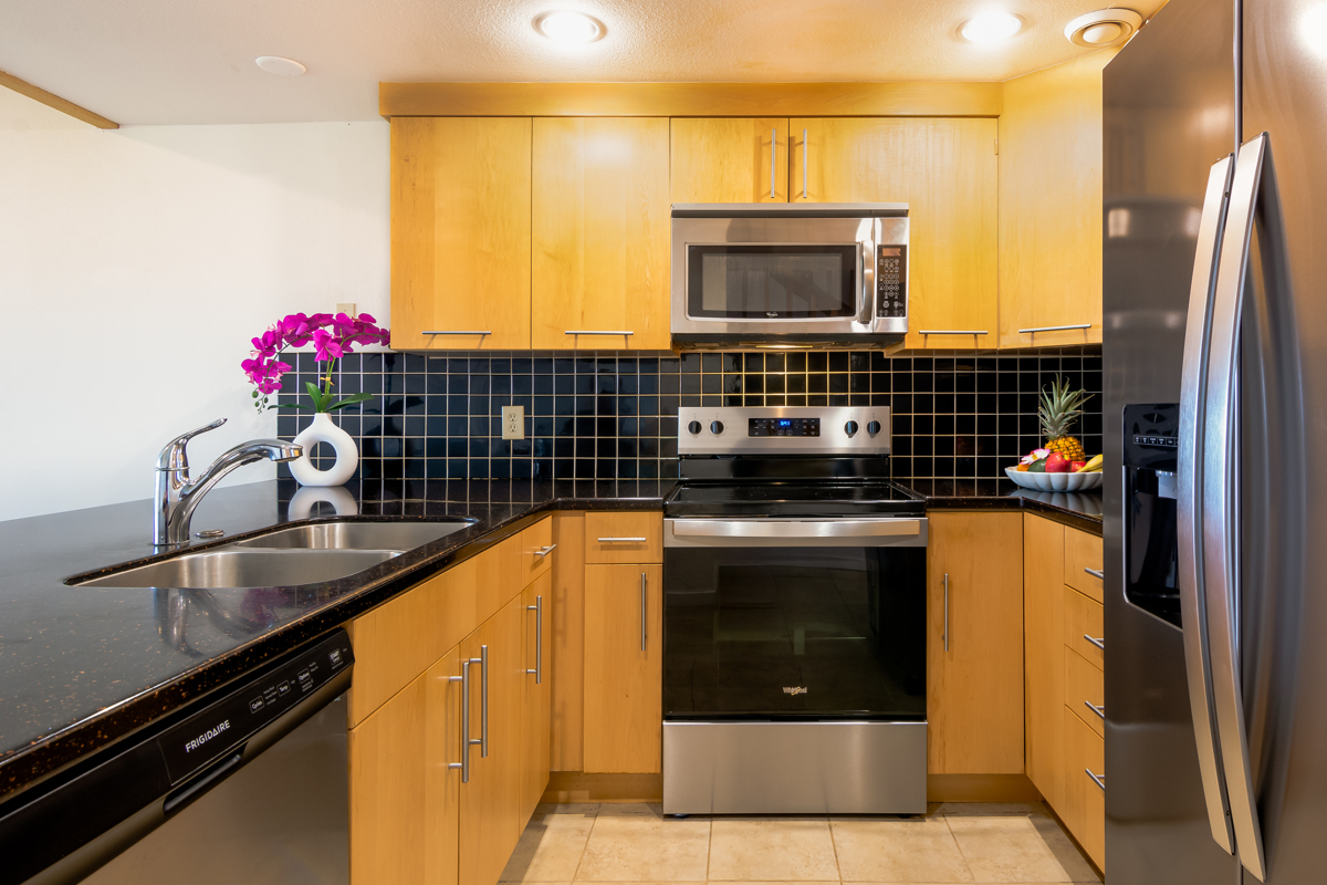 68-3840 Lua Kula Street, Unit D201 Waikoloa, HI 96738 - Photo 5 of 30 a kitchen with a sink and cabinets