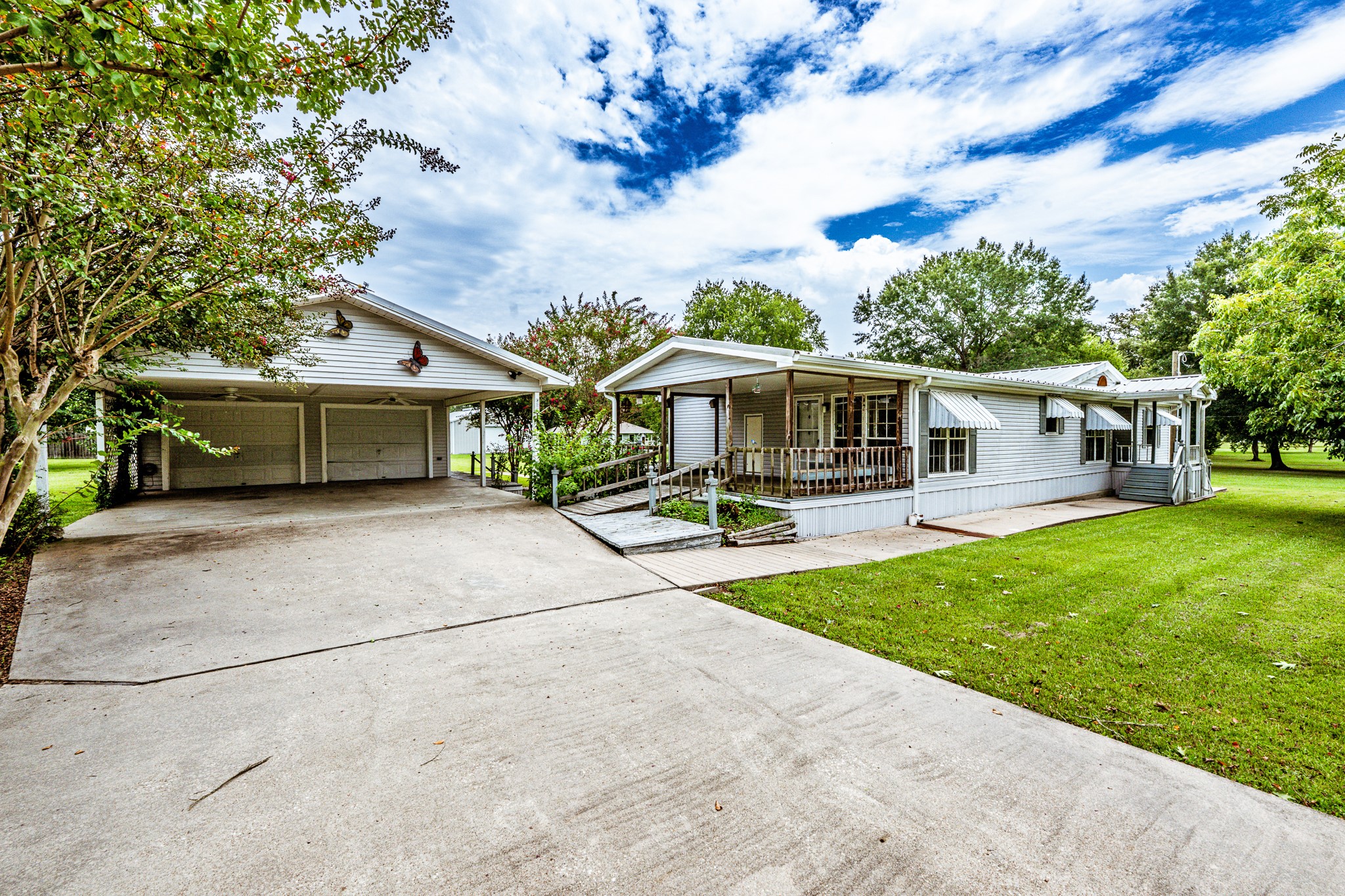 a front view of a house with garden